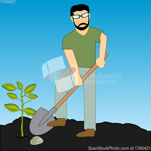 Image of Man boarding the plants concerns with with shovel