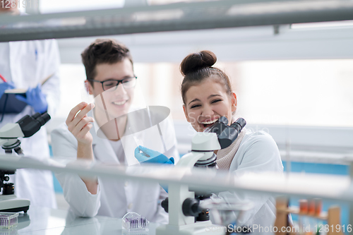 Image of Group of young medical students doing research