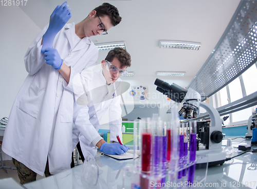 Image of Group of young medical students doing research