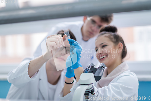 Image of Group of young medical students doing research