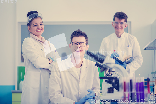 Image of Group of young medical students doing research