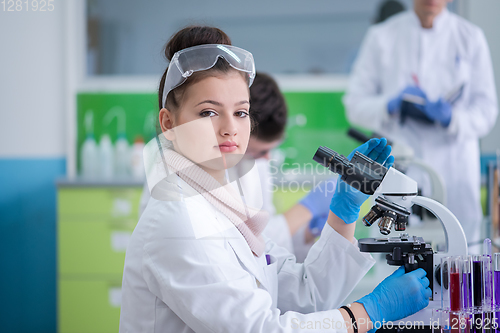 Image of Group of young medical students doing research