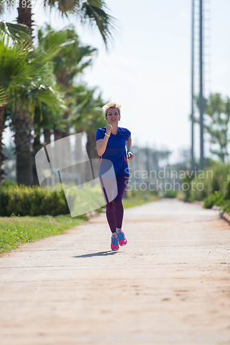 Image of young female runner training for marathon