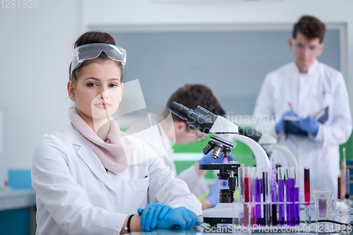 Image of Group of young medical students doing research