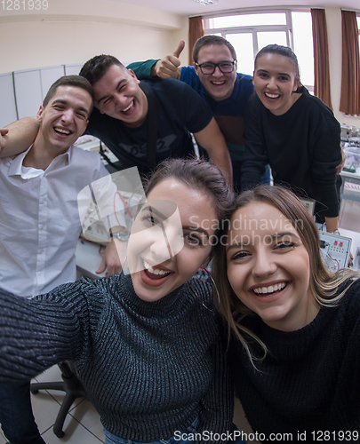 Image of young happy students doing selfie picture