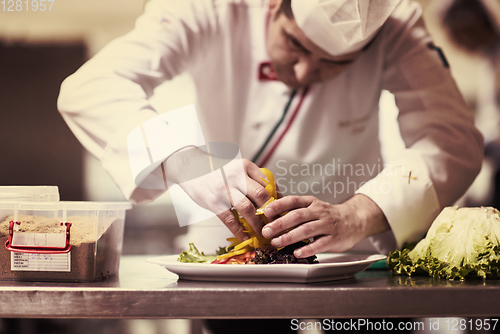 Image of chef serving vegetable salad