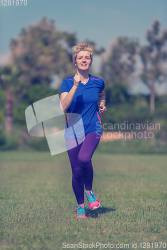 Image of young female runner training for marathon