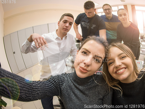 Image of young happy students doing selfie picture