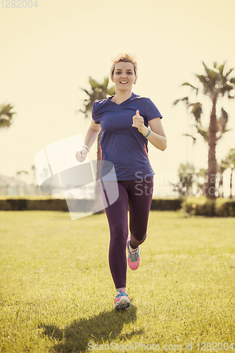 Image of young female runner training for marathon