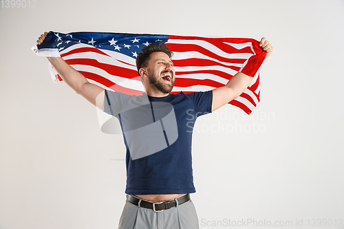 Image of Young man with the flag of United States of America