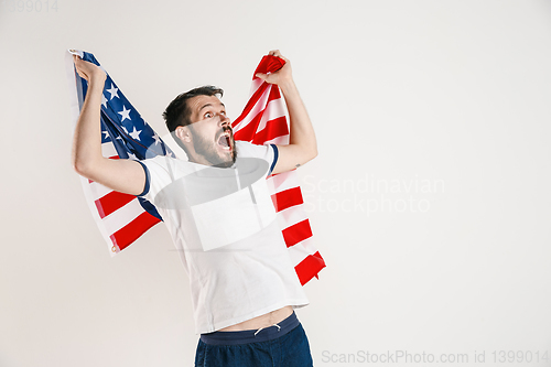 Image of Young man with the flag of United States of America