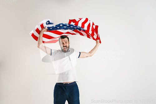 Image of Young man with the flag of United States of America