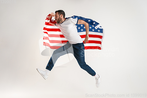 Image of Young man with the flag of United States of America