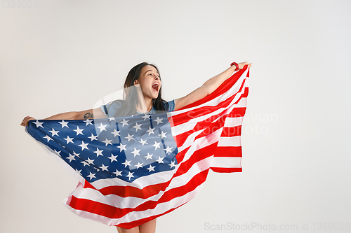 Image of Young woman with the flag of United States of America