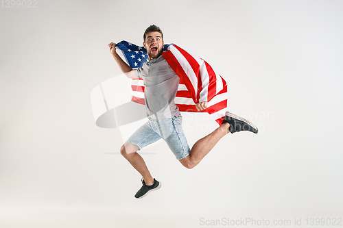 Image of Young man with the flag of United States of America