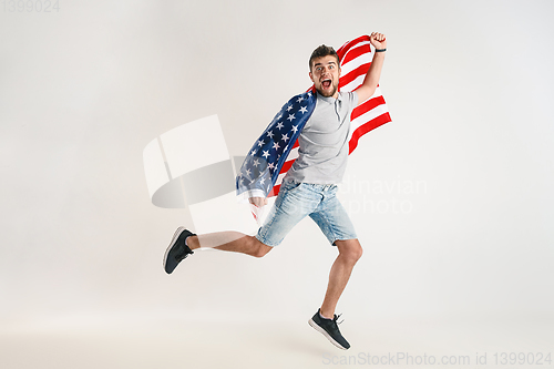 Image of Young man with the flag of United States of America