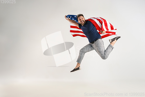 Image of Young man with the flag of United States of America