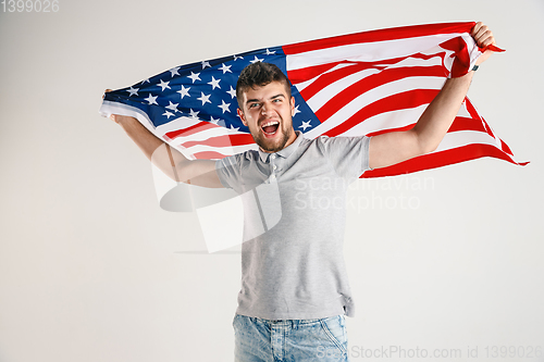 Image of Young man with the flag of United States of America