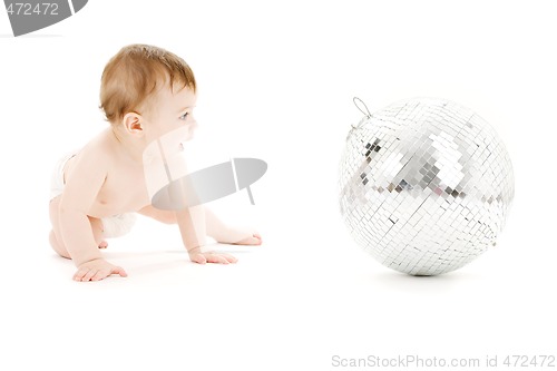 Image of adorable baby boy with big disco ball