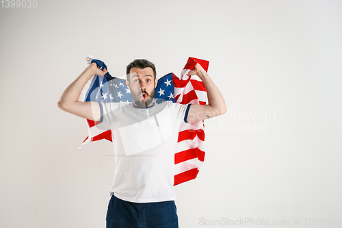 Image of Young man with the flag of United States of America