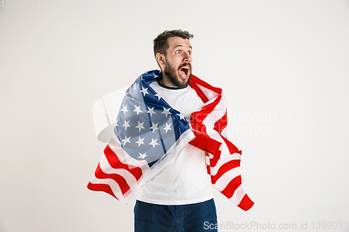 Image of Young man with the flag of United States of America