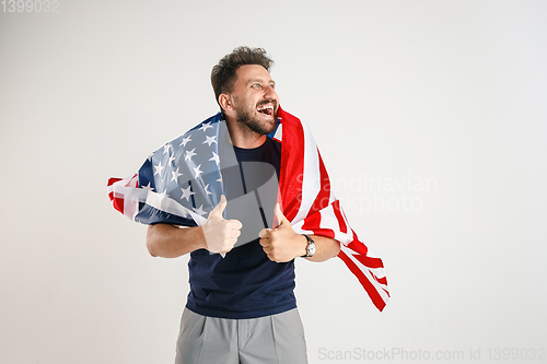 Image of Young man with the flag of United States of America