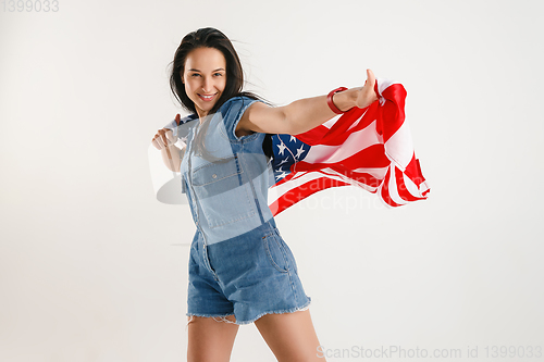 Image of Young woman with the flag of United States of America