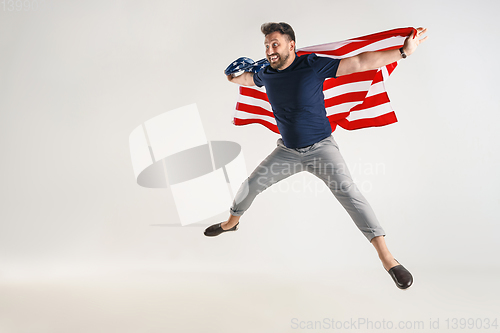 Image of Young man with the flag of United States of America