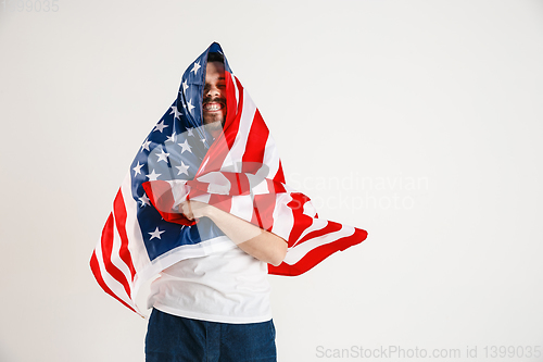 Image of Young man with the flag of United States of America