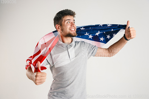 Image of Young man with the flag of United States of America