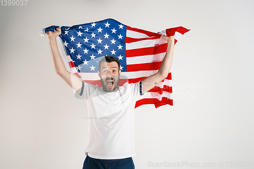 Image of Young man with the flag of United States of America