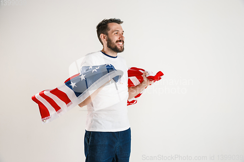 Image of Young man with the flag of United States of America