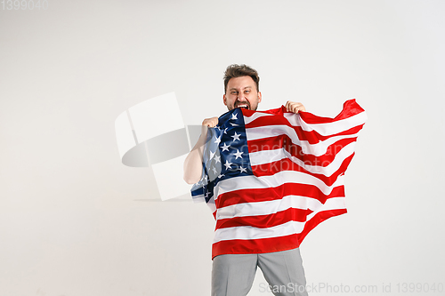 Image of Young man with the flag of United States of America