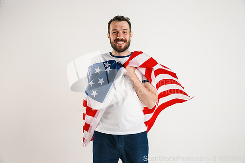 Image of Young man with the flag of United States of America