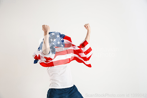 Image of Young man with the flag of United States of America