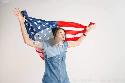 Image of Young woman with the flag of United States of America