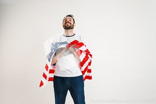 Image of Young man with the flag of United States of America