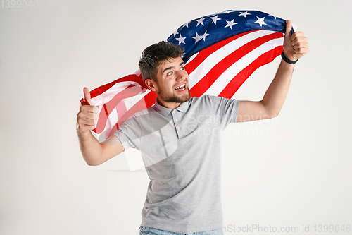 Image of Young man with the flag of United States of America