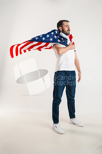 Image of Young man with the flag of United States of America