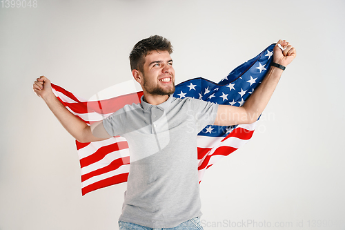 Image of Young man with the flag of United States of America