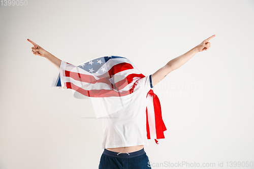 Image of Young man with the flag of United States of America