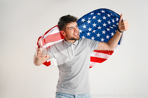 Image of Young man with the flag of United States of America