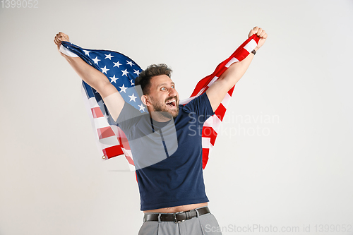 Image of Young man with the flag of United States of America