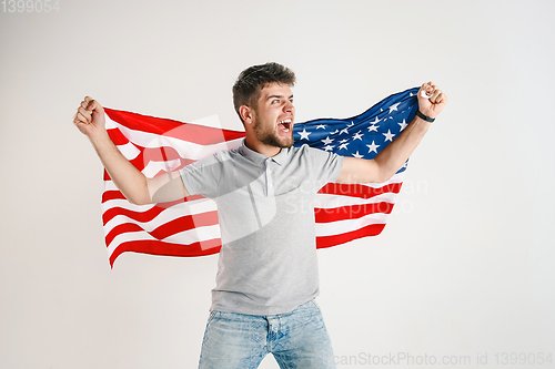 Image of Young man with the flag of United States of America