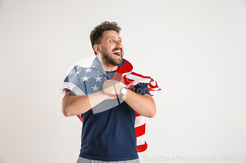 Image of Young man with the flag of United States of America