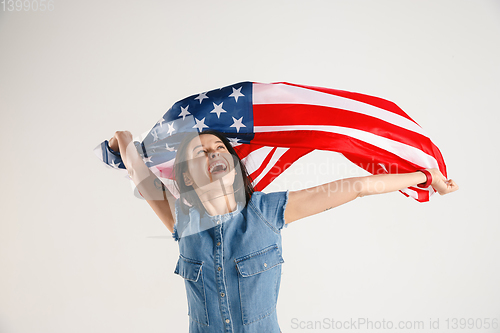 Image of Young woman with the flag of United States of America