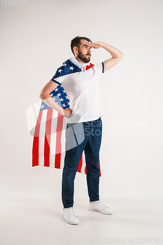 Image of Young man with the flag of United States of America