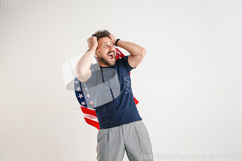 Image of Young man with the flag of United States of America