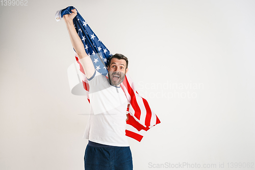 Image of Young man with the flag of United States of America