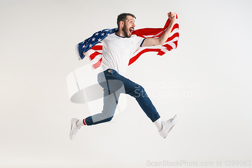 Image of Young man with the flag of United States of America